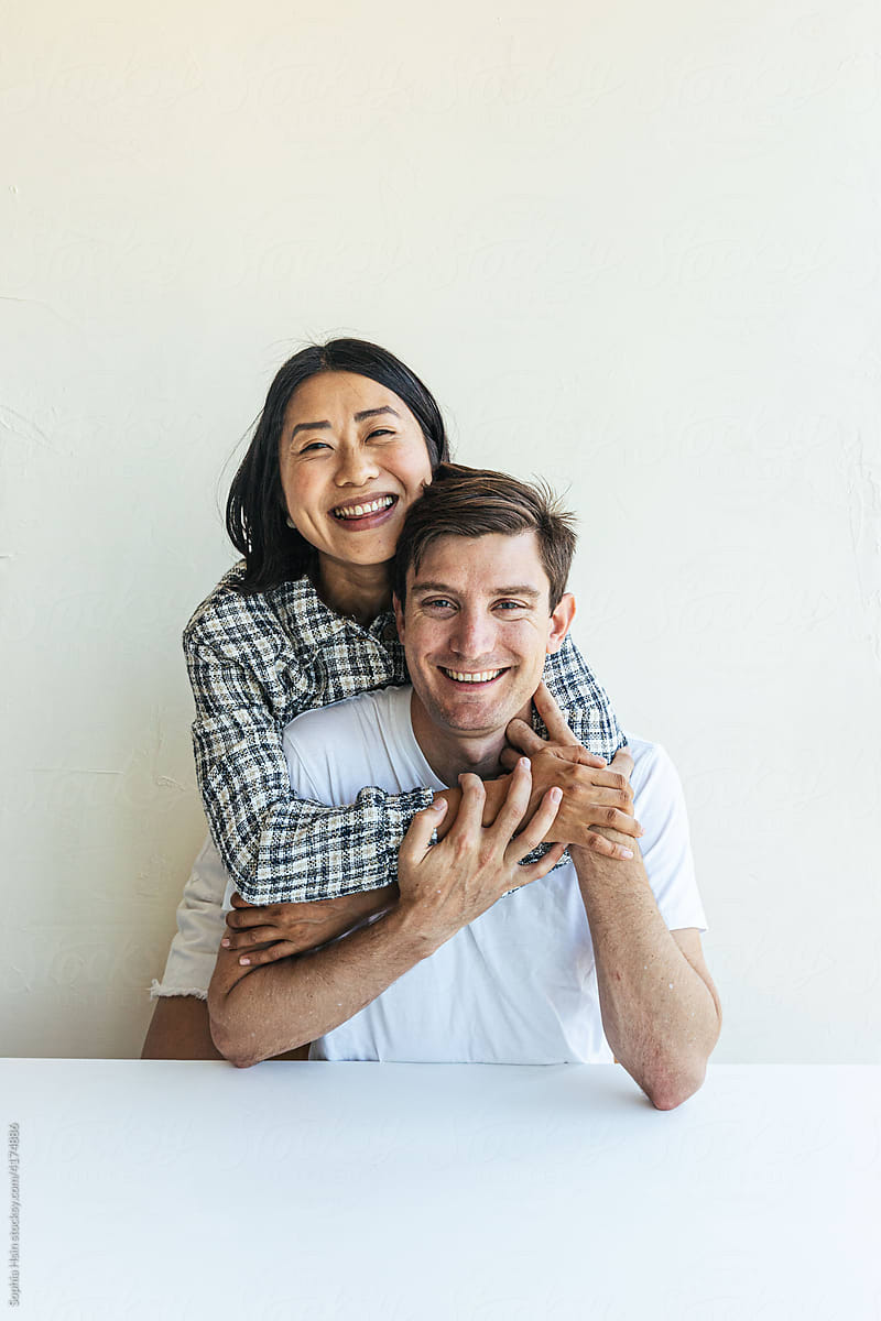 Young couple smiling at camera