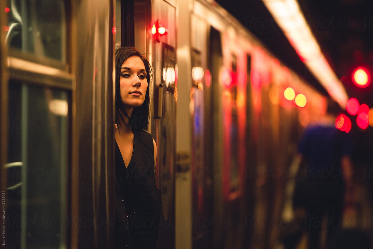 Woman Standing By Subway Train At Night By Stocksy Contributor