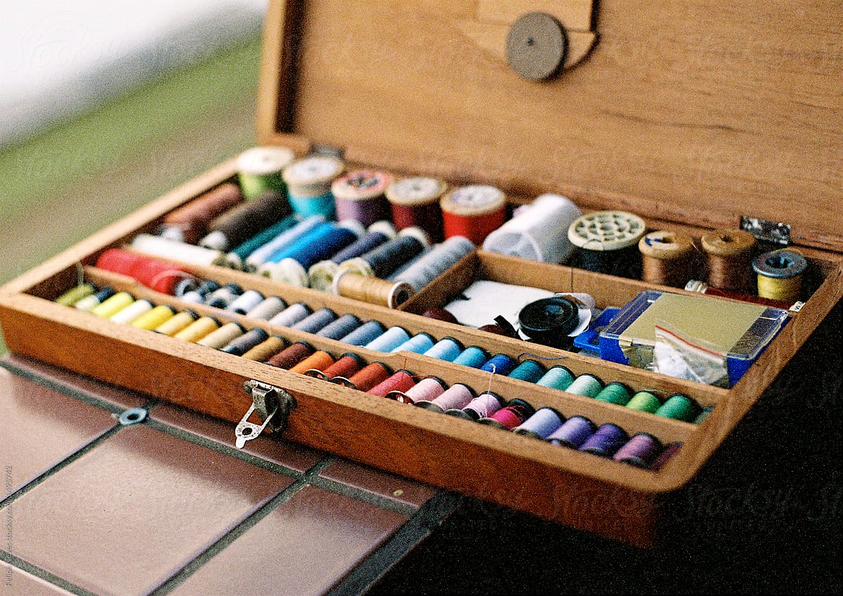 Colorful thread spools in a Timber box