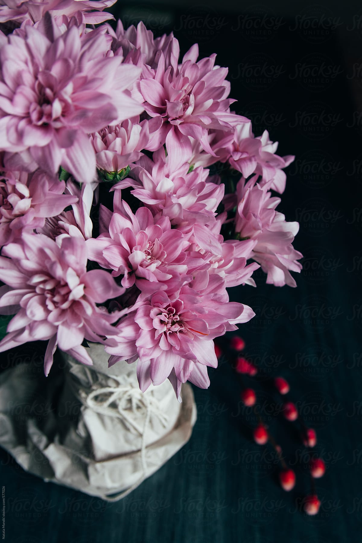 Bouquet of pink flowers on dark background
