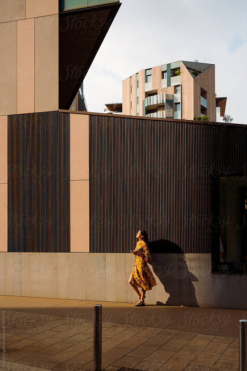 Woman in a sunlit area in the city