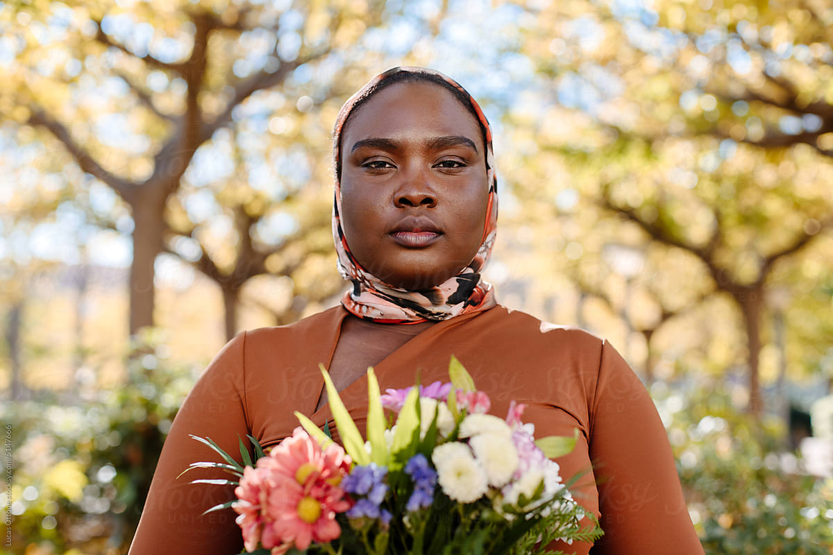 Black muslim woman with flowers