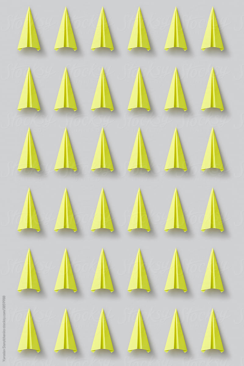 Pattern of yellow origami paperplanes