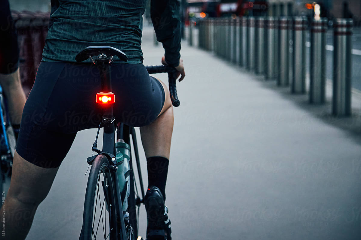 Rear bike light on a cycle with female rider