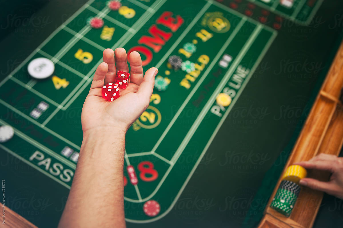 Casino: Man Ready To Roll For Luck At Craps Table