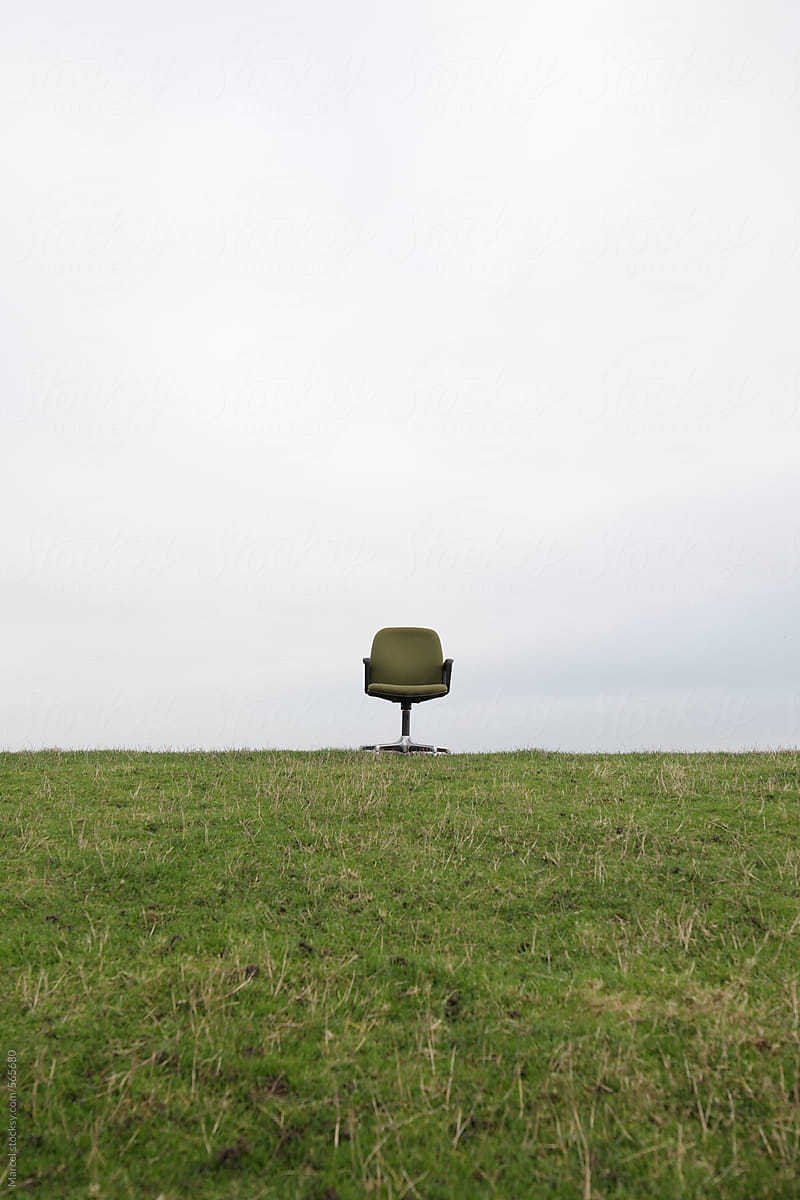 Green office chair on a dutch dike