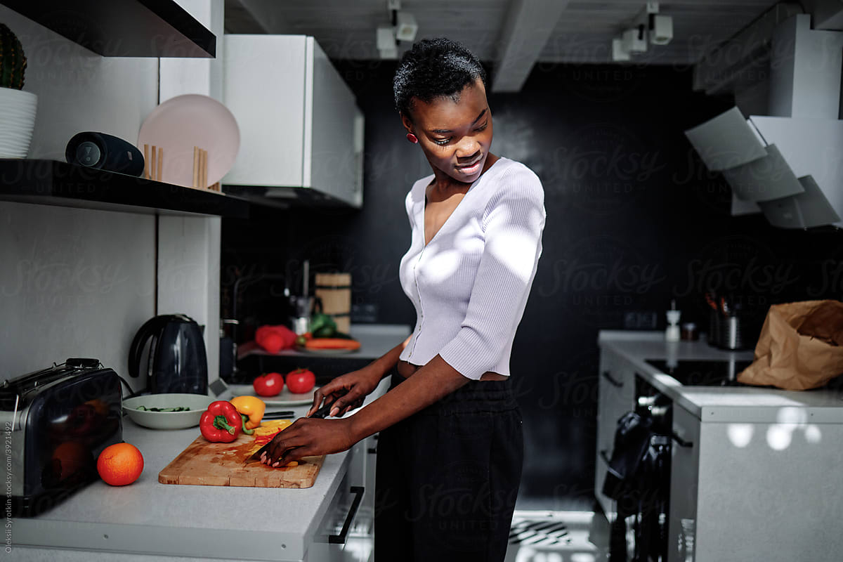 Female doing housework in kitchen
