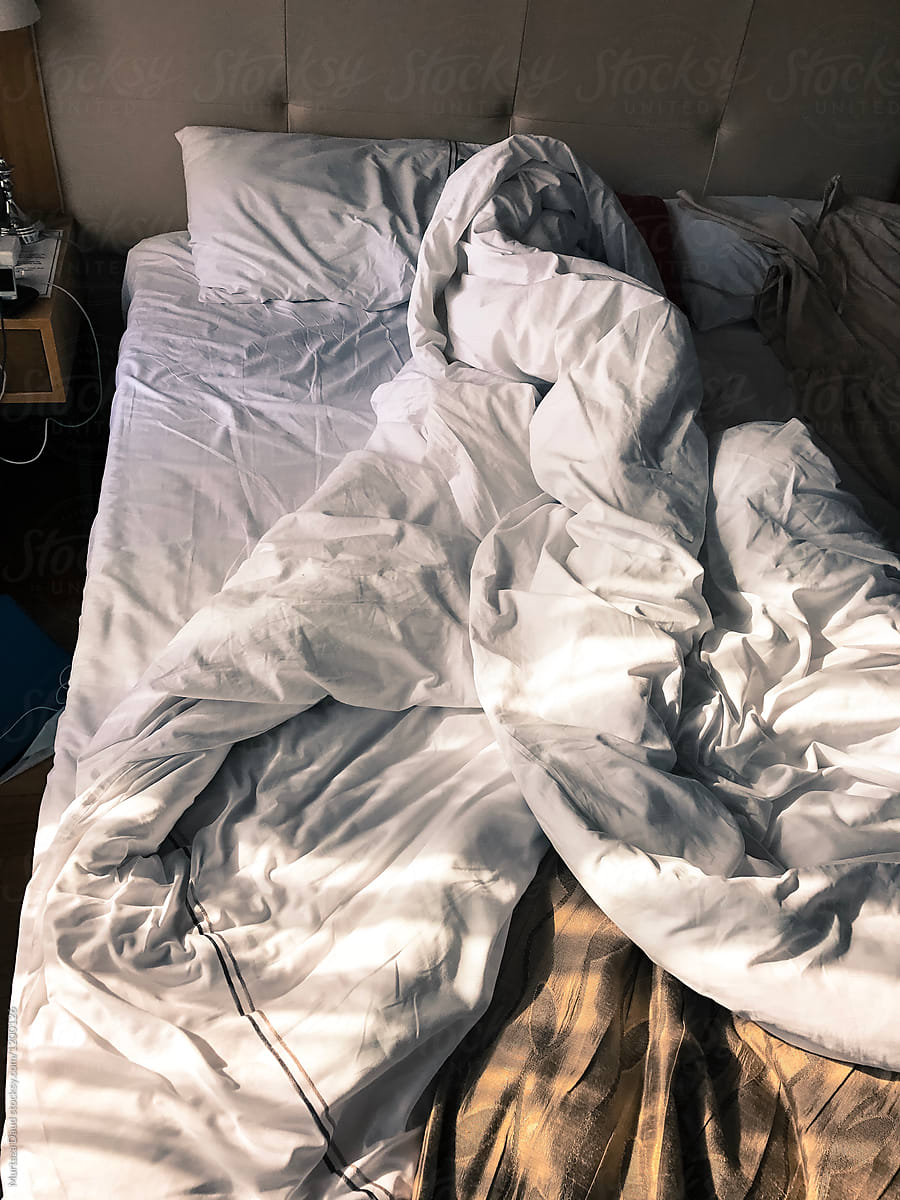 A Messy Morning Bed by Stocksy Contributor Murtaza Daud - Stocksy