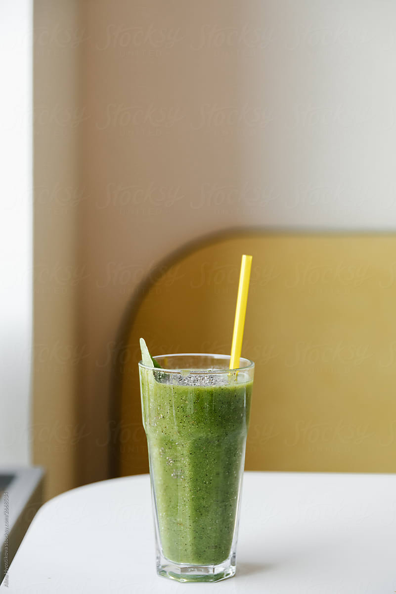 Front view of healthy green smoothie in glass.