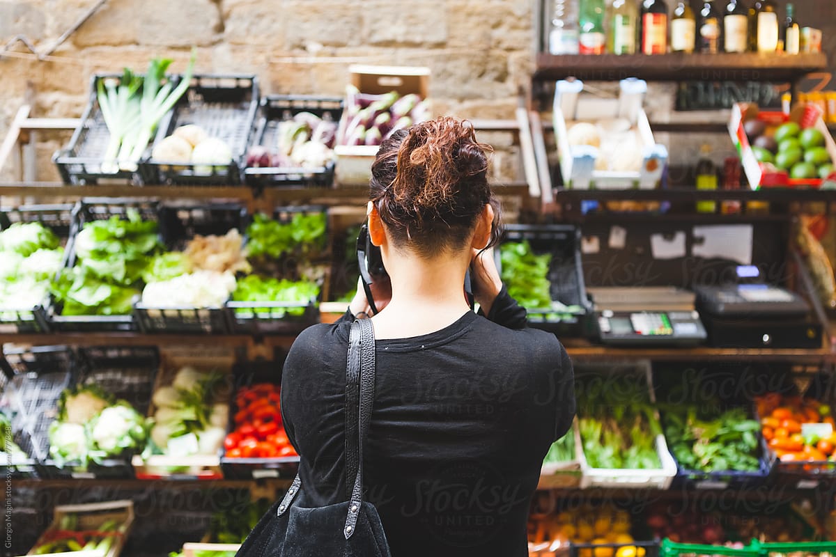 Young Woman Photographing Vegetables and Fruits Shop Outdoors in Italy