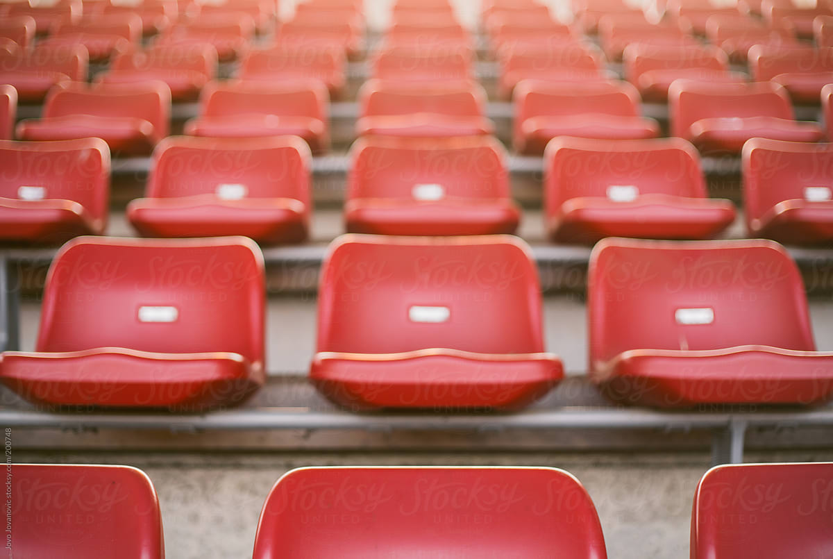 Empty red seats in football stadium