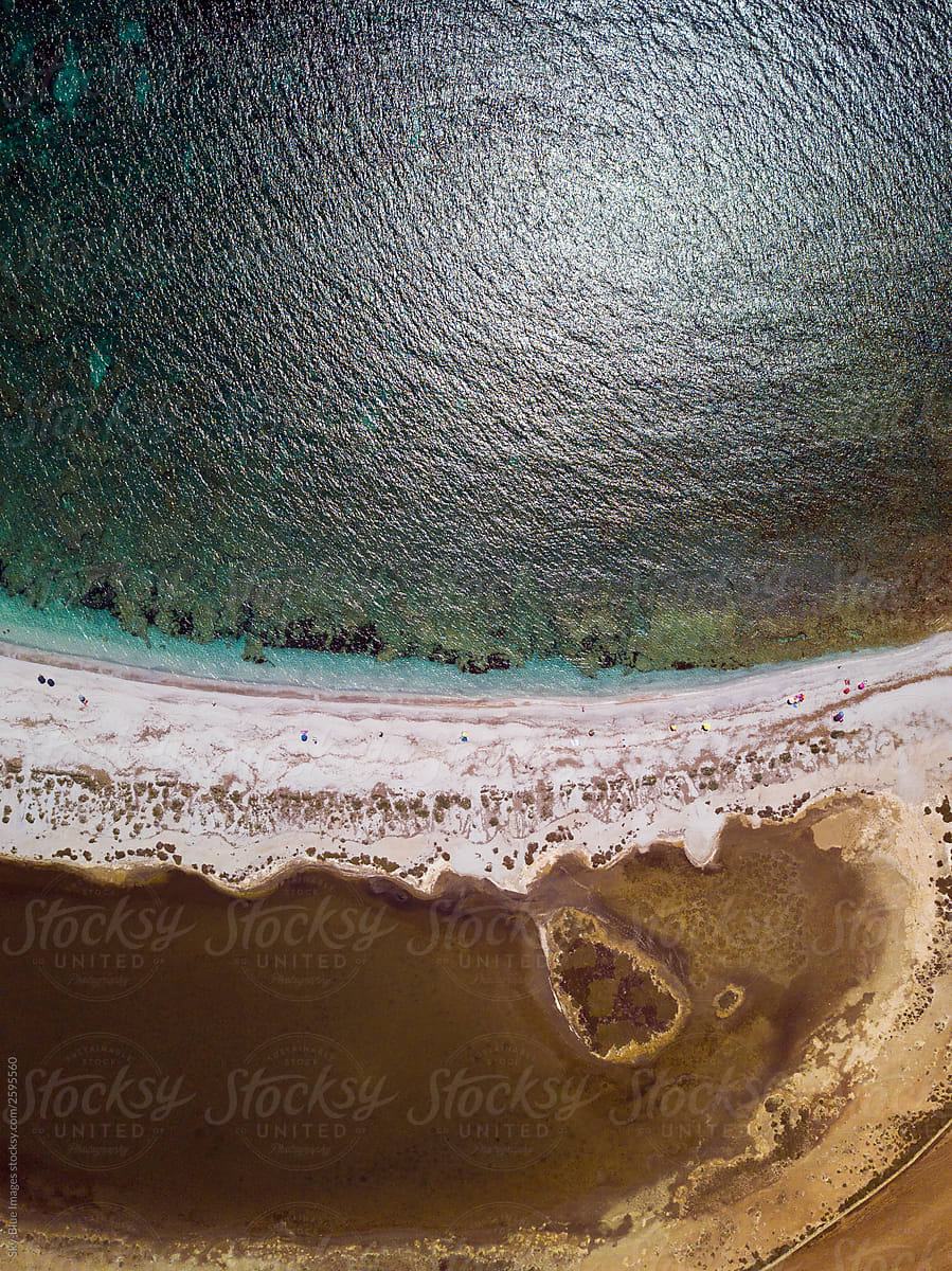 Arial view of a natural arch along the beach in Sardinia.