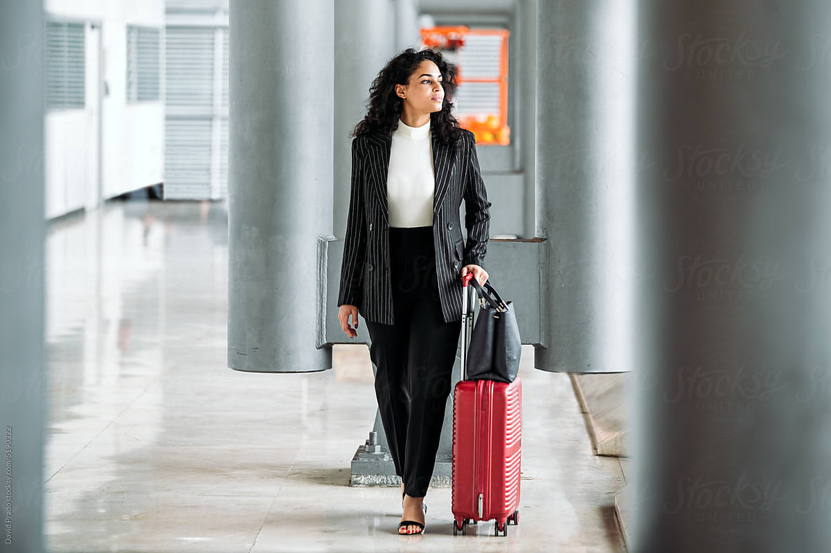 Businesswoman with suitcare in airport