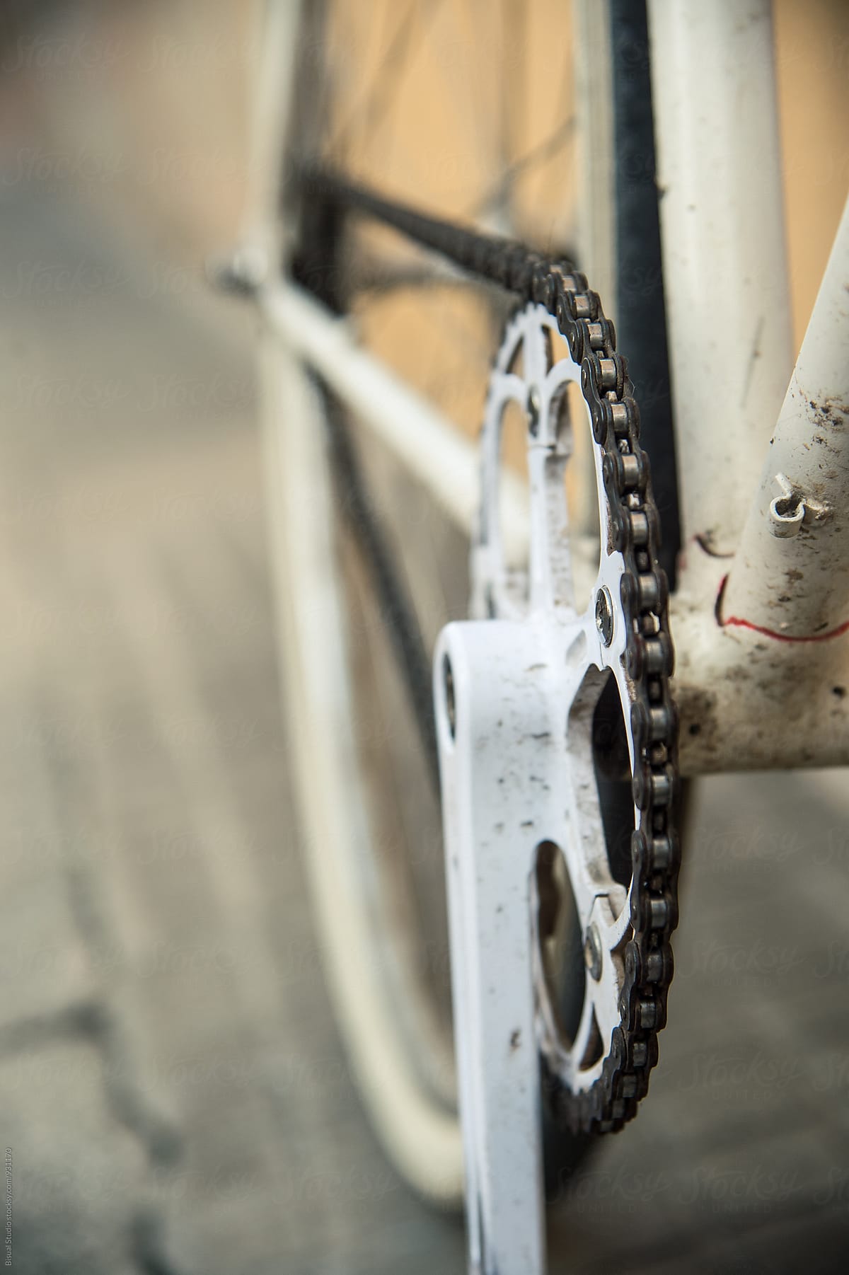 Bike chain on a white fixed gear bicycle