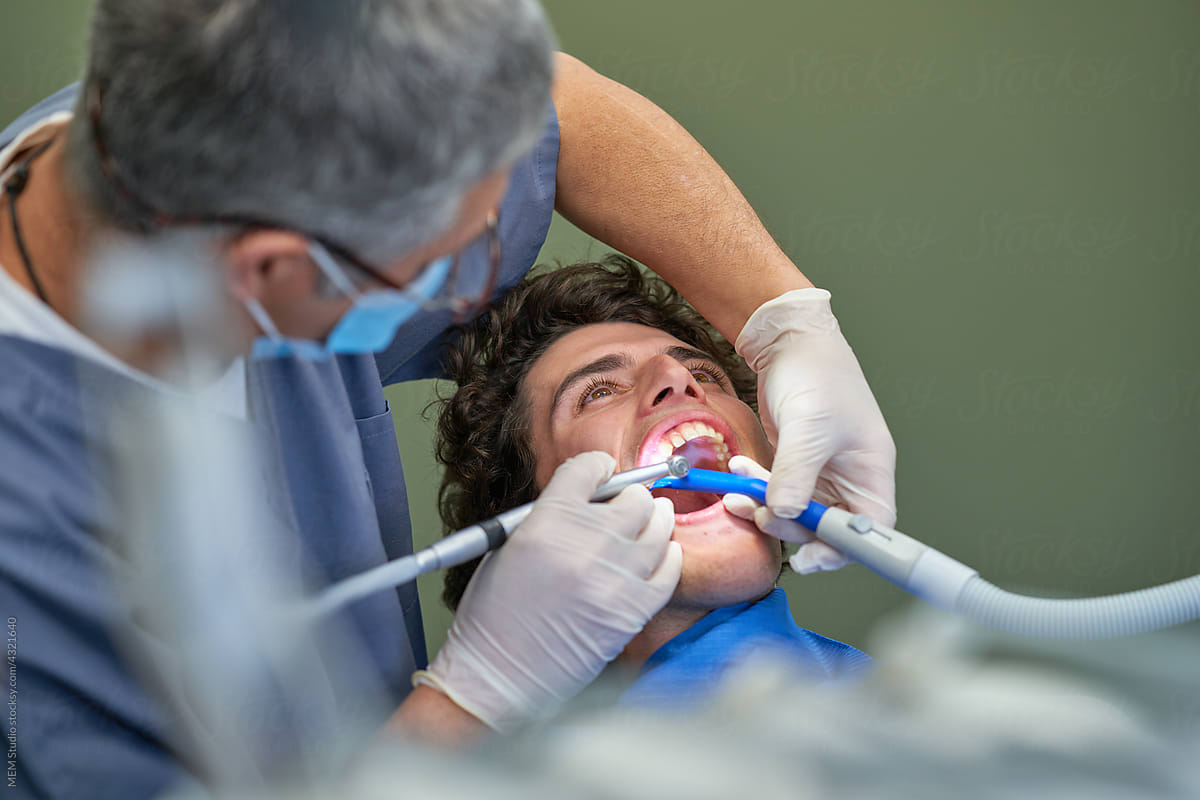 Orthodontist performing tartar cleaning
