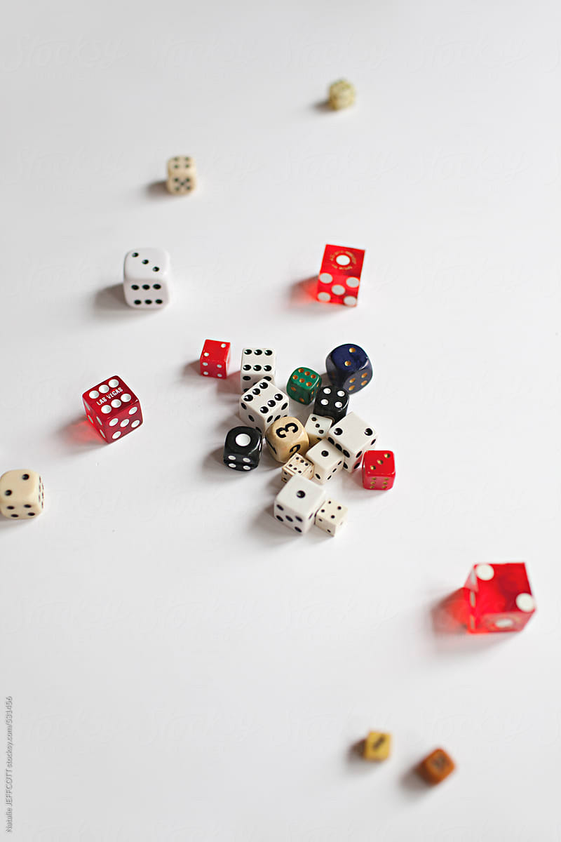 a collection of vintage dice scattered on a white background