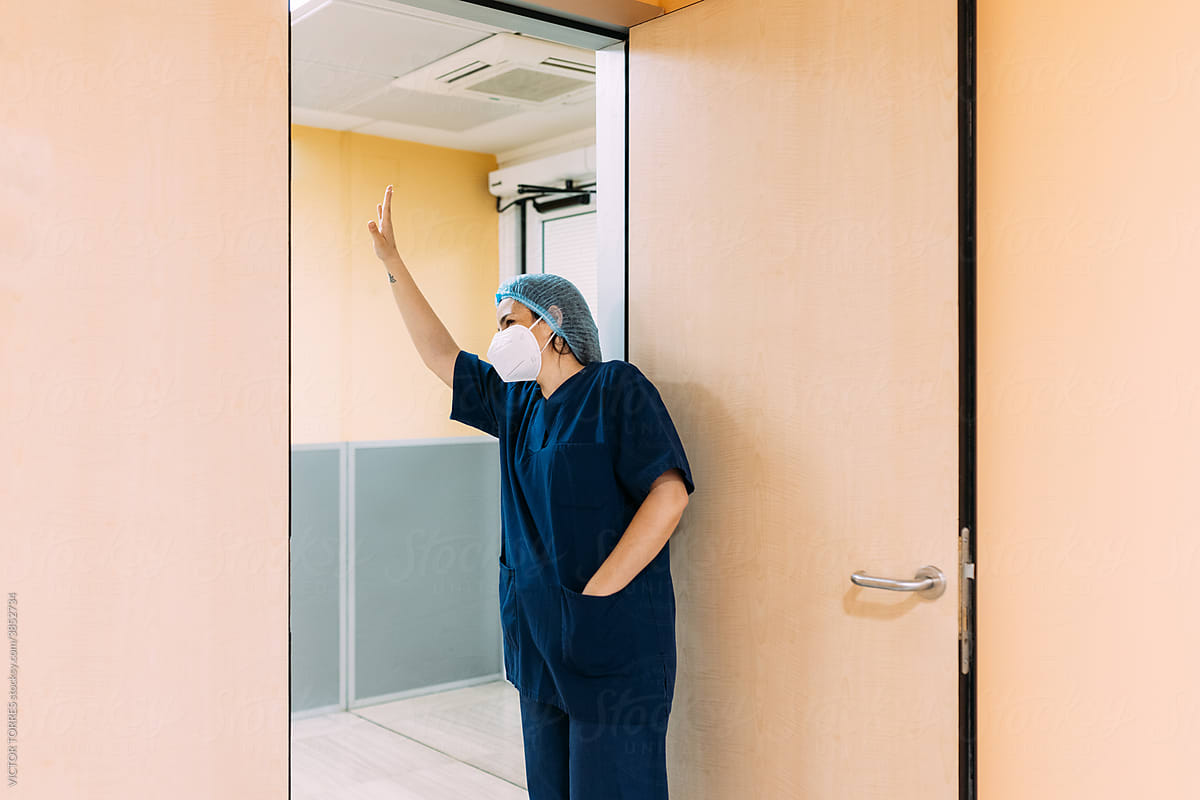 Real nurse in white uniform in hospital corridor