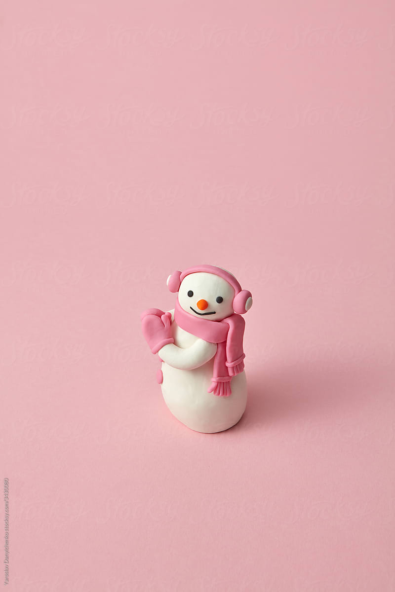 Cute snowman handmade from modeling clay or plasticine.