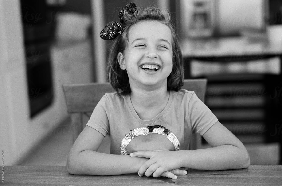 Cute Young Girl Laughing Hard By Stocksy Contributor Jakob Lagerstedt Stocksy 