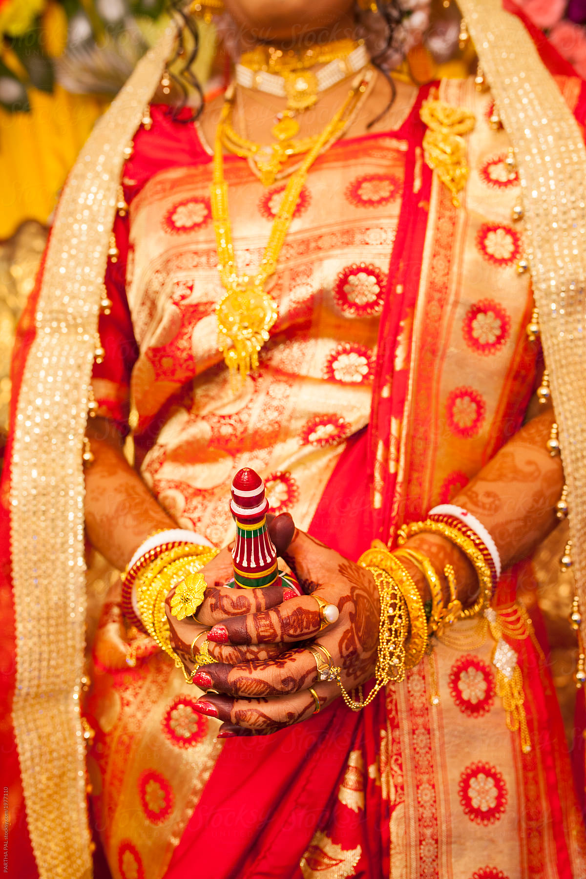 Decorative hands smudged with Mehendi  of a Hindu Bride in marriage ceremony