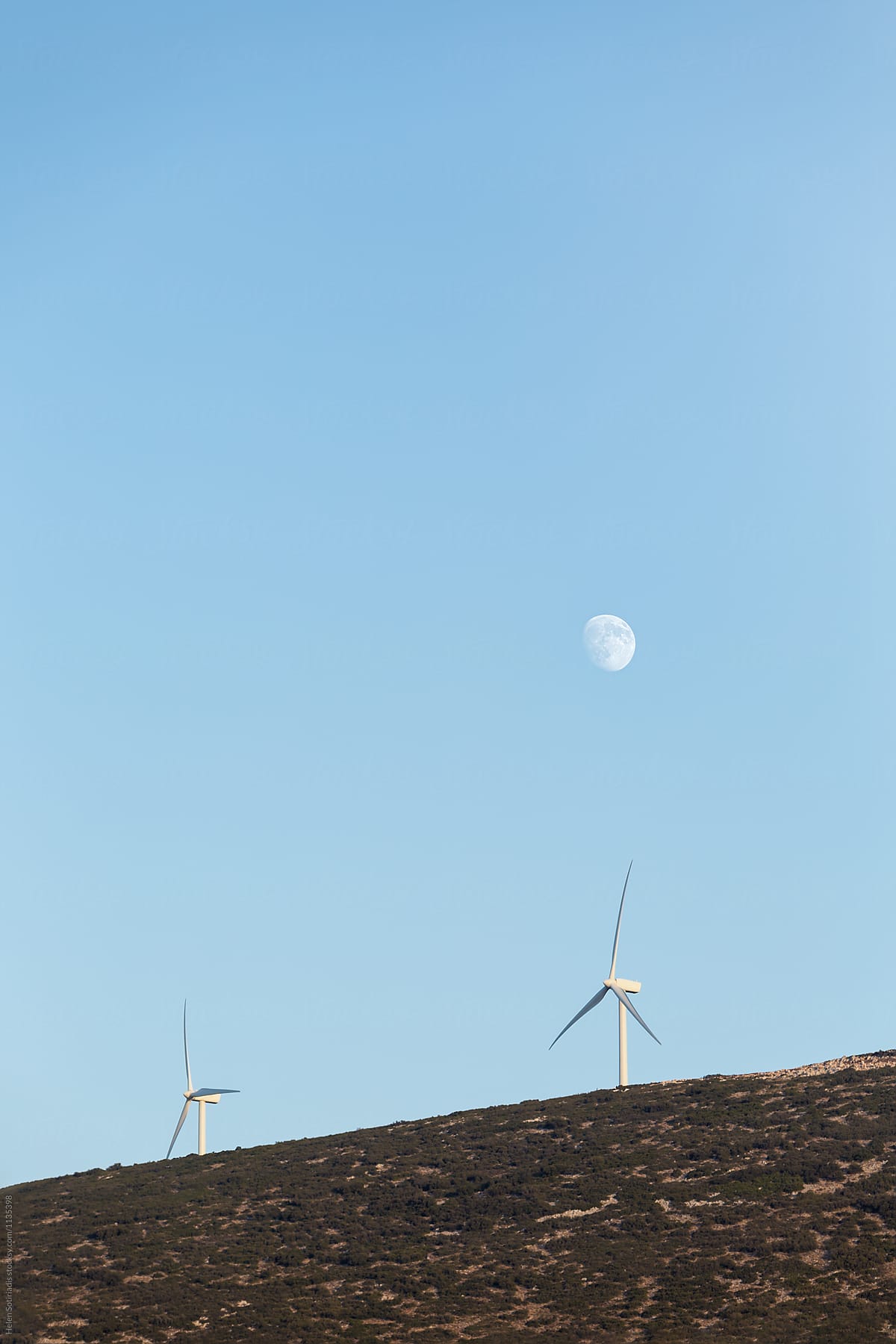 Two Wind Turbines with the Moon