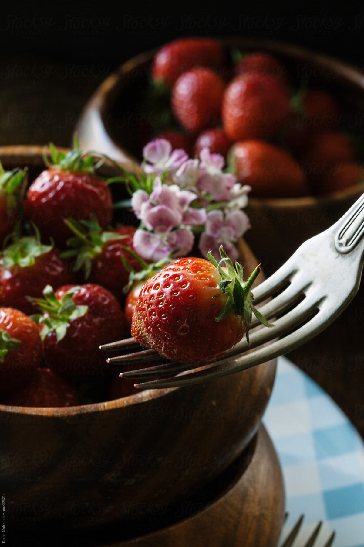 Strawberry\'s in wooden bowls.