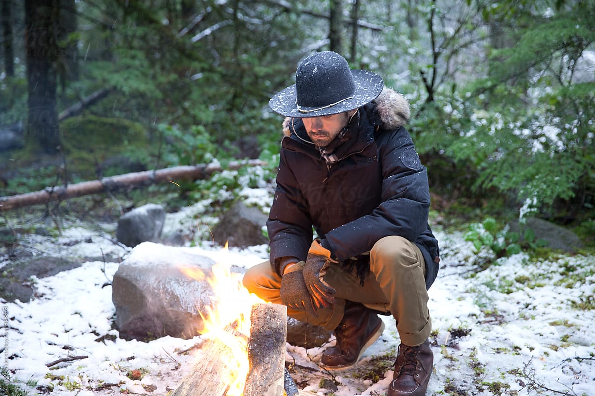 Man Next To Fire In Snow