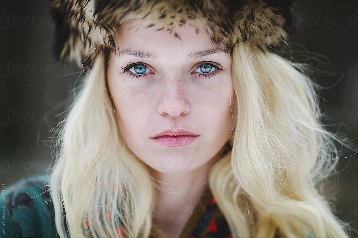 Portrait Of A Beautiful Woman With Freckles And Blue Eyes By