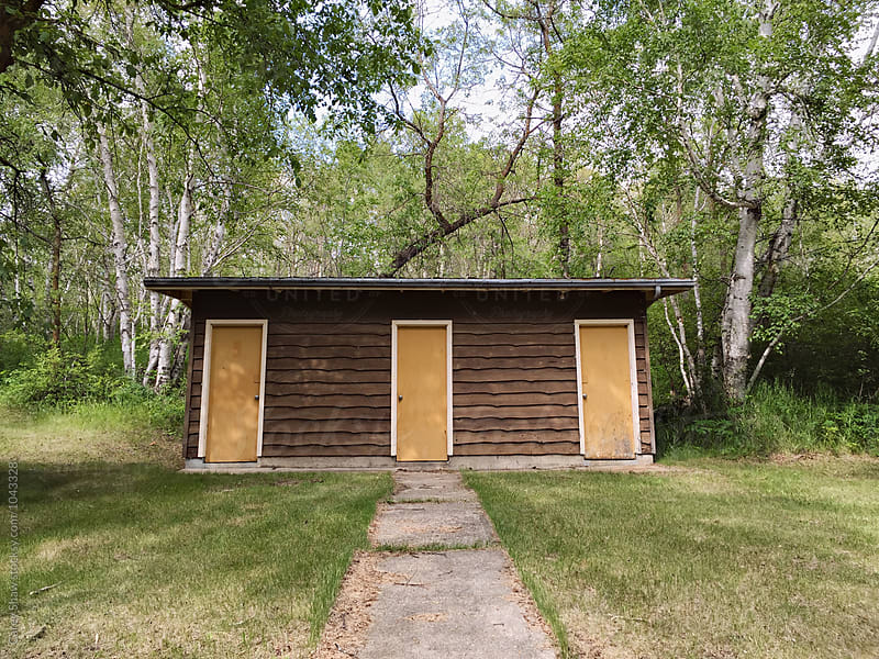 Wood shack with three yellow doors
