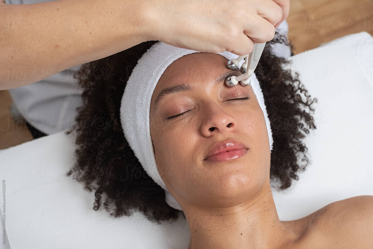 Woman Having A Beauty Treatment With A Facial Machine