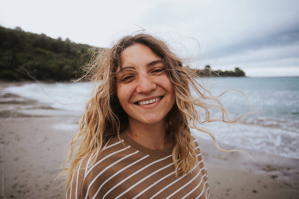 Portrait Of Smiling Woman On The Beach.