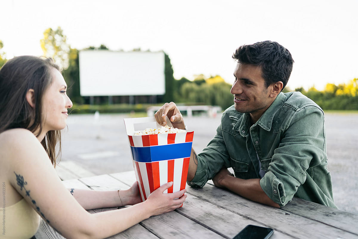 Couple dating at an outdoor drive-in movie