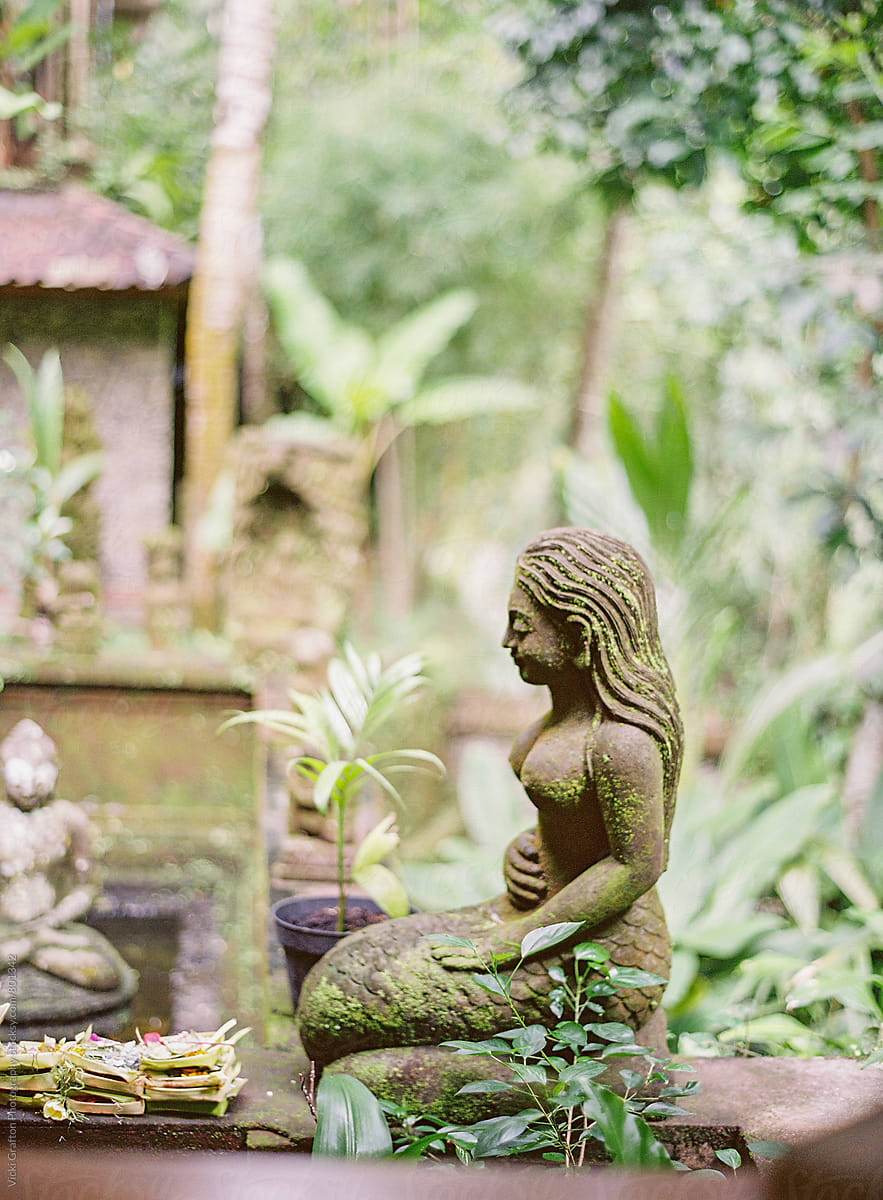 Balinese garden stone carving statue Ubud Bali