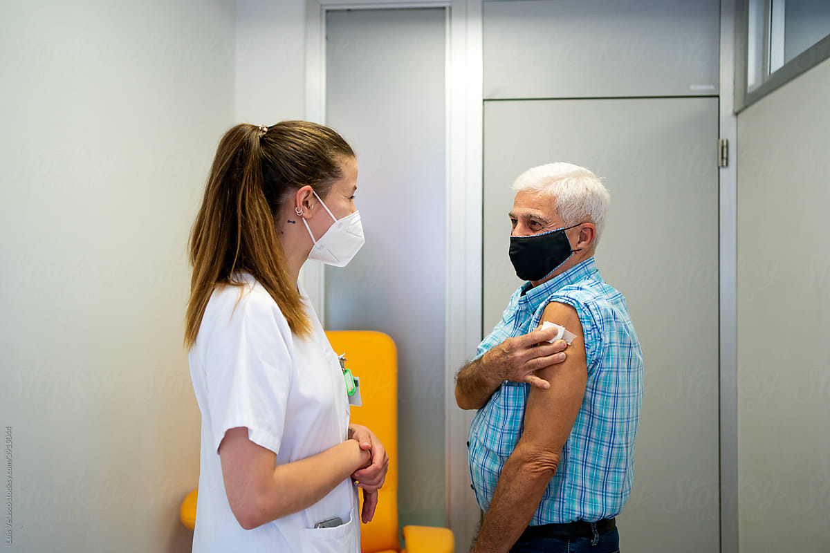 Old Man Receives COVID-19 Vaccination In The Hospital.