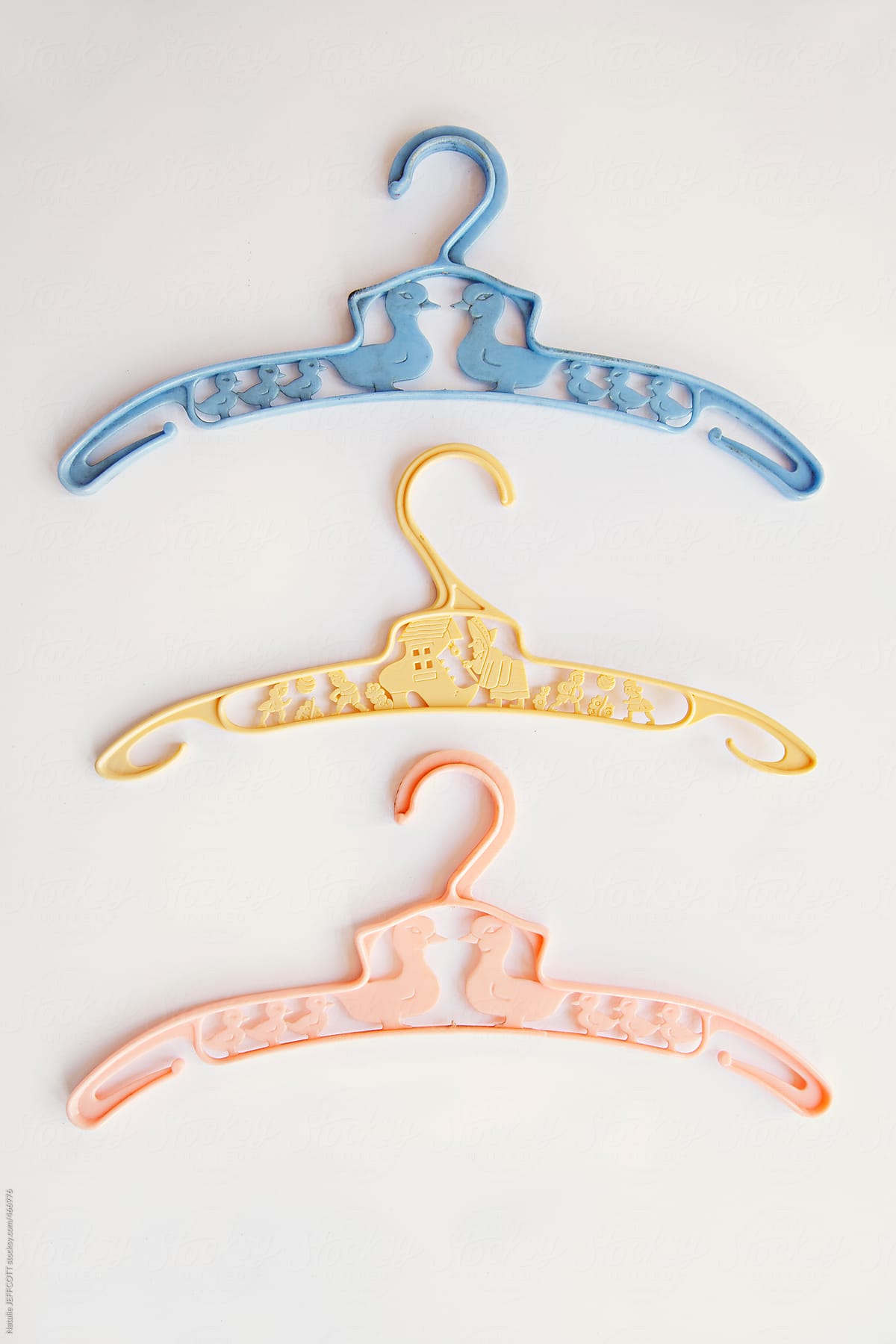 A Set Of Three Baby Vintage Clothes Hangers by Stocksy Contributor  Natalie JEFFCOTT - Stocksy