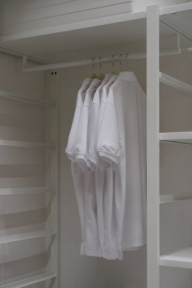 Minimal all white tshirts in the closet at home