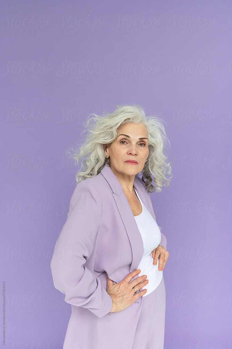 Woman With White Natural Hair Posing At Purple Background