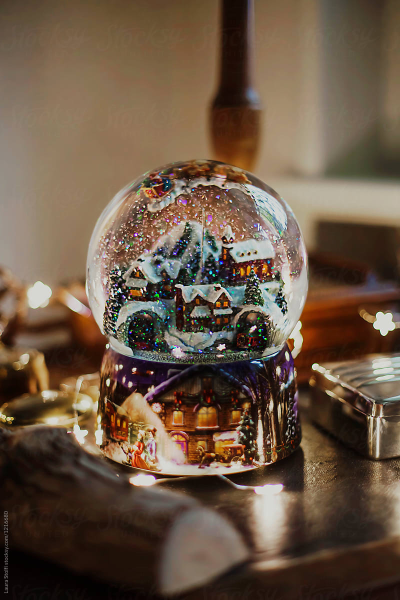 Mountain village inside Christmas snow globe