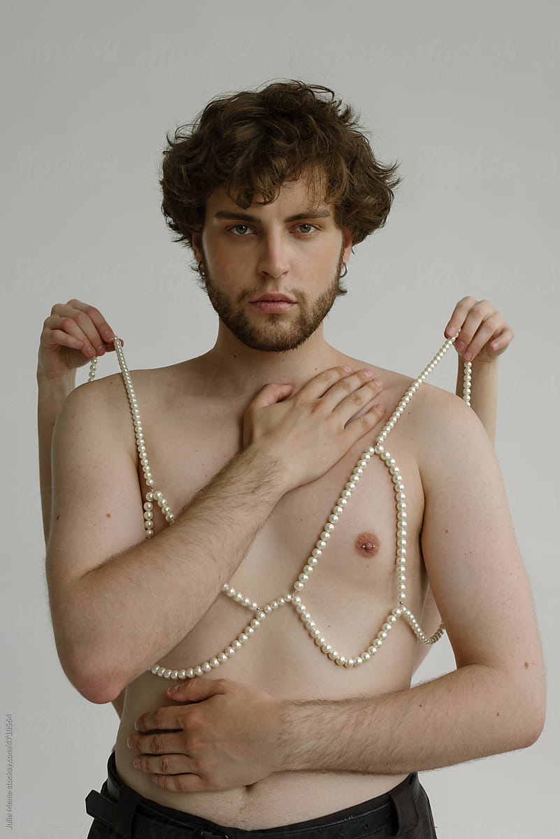 Topples curly guy with pierced nipple & hands hold bra on him
