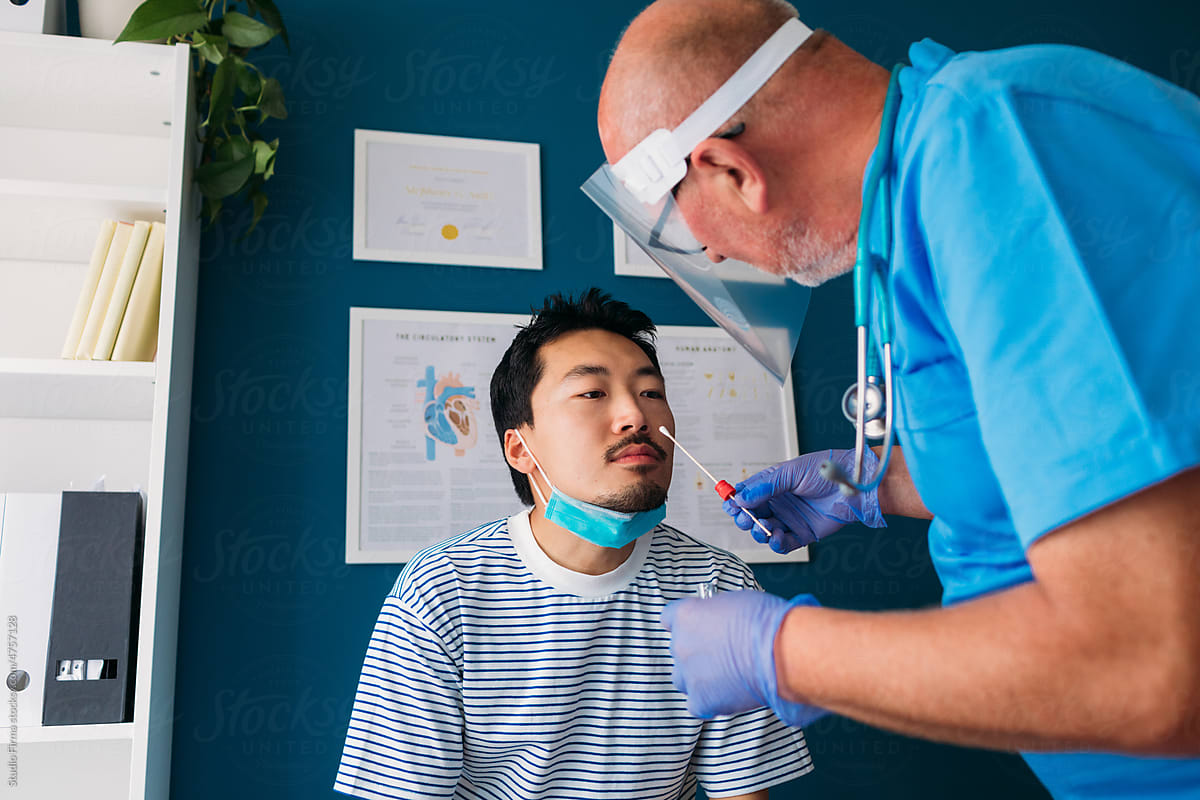 Doctor Taking Nasal Swab from Patient