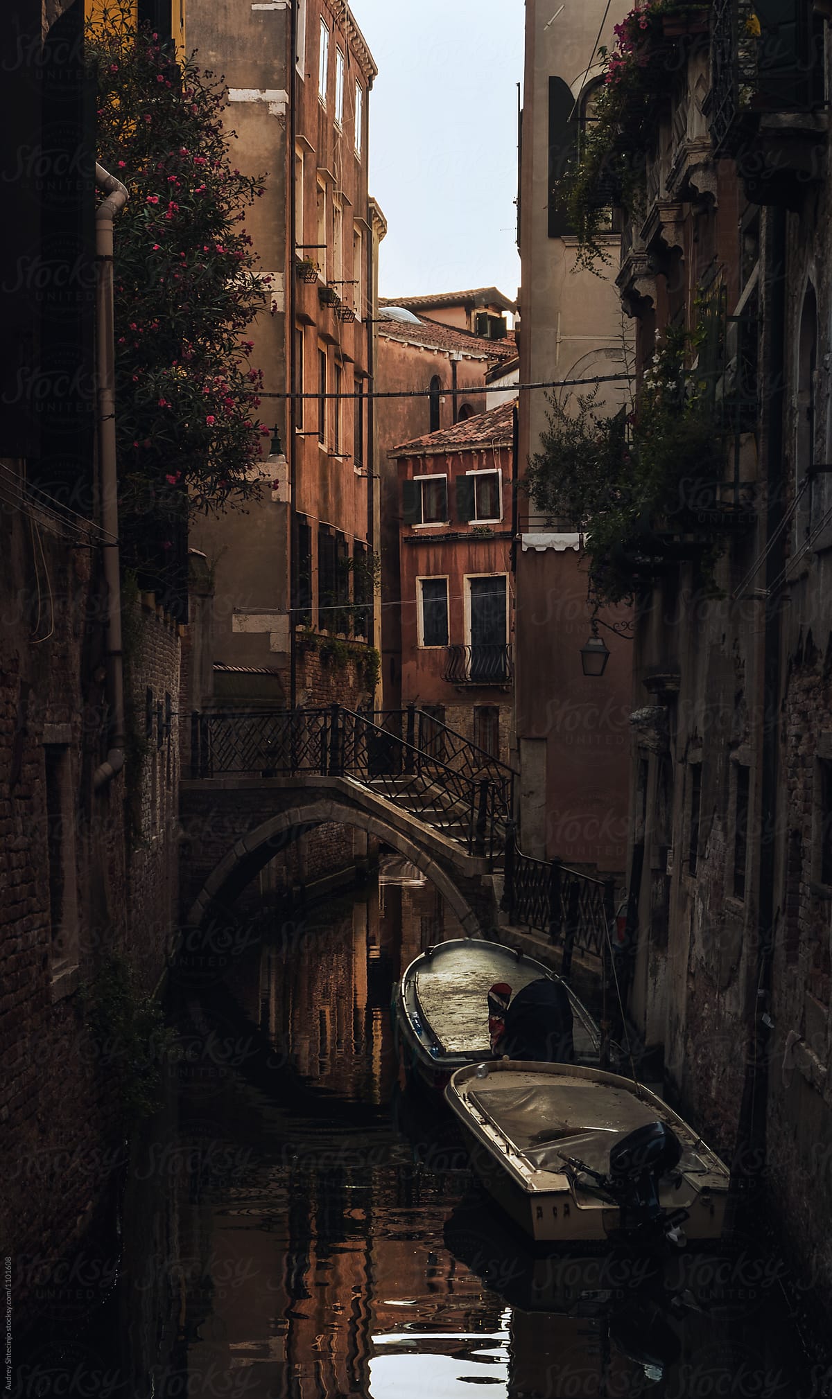 Detail of traditional street with small bridge over water canal in Venice. Italy