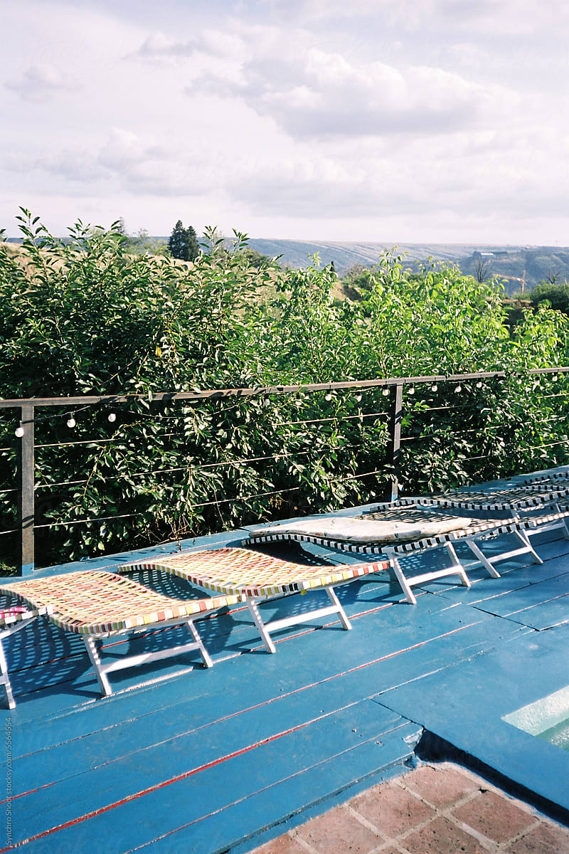 Sun loungers in outdoor pool