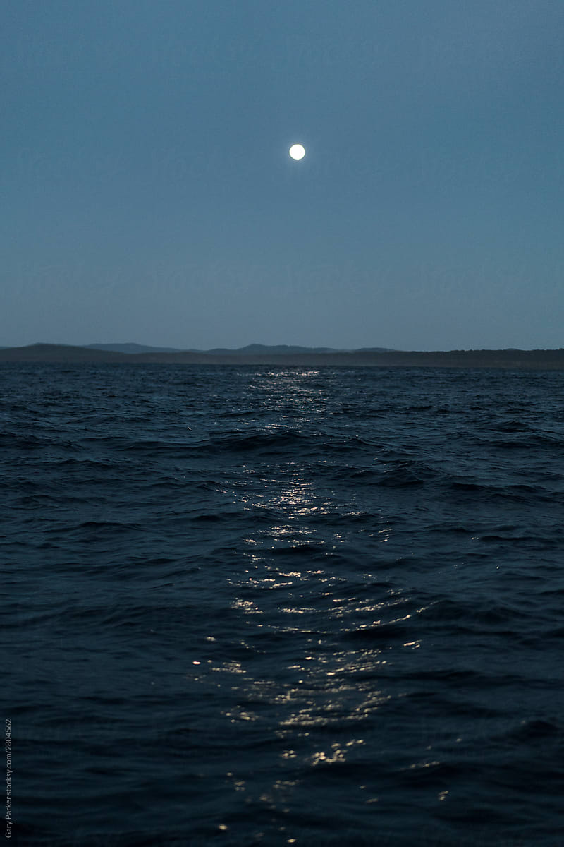 Moonset over empty ocean