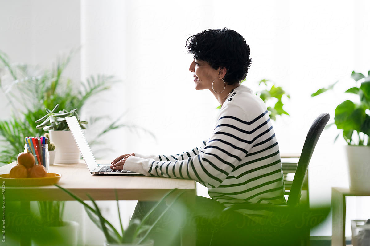 Freelance woman typing on laptop