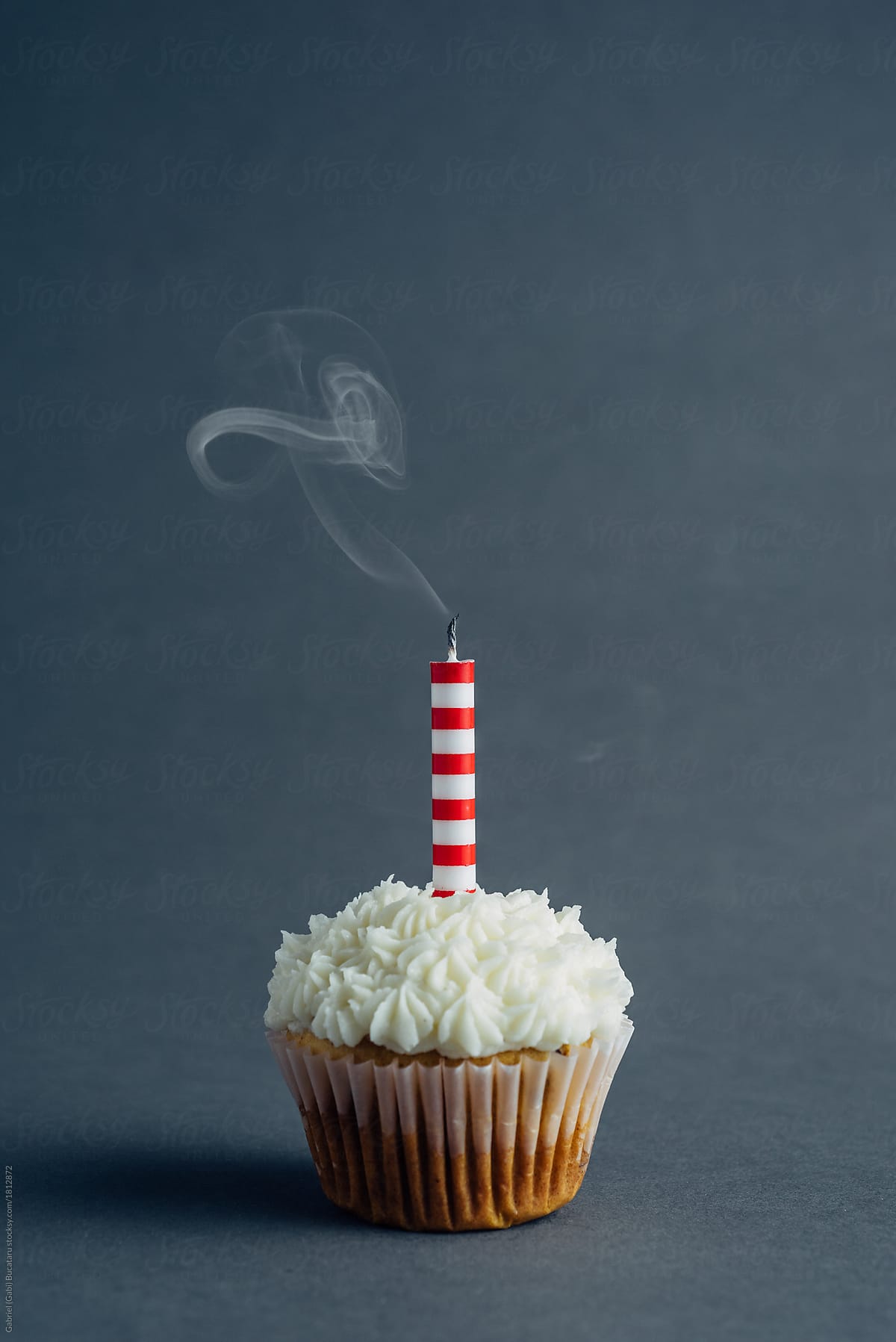 Birthday cake with a smoking candle