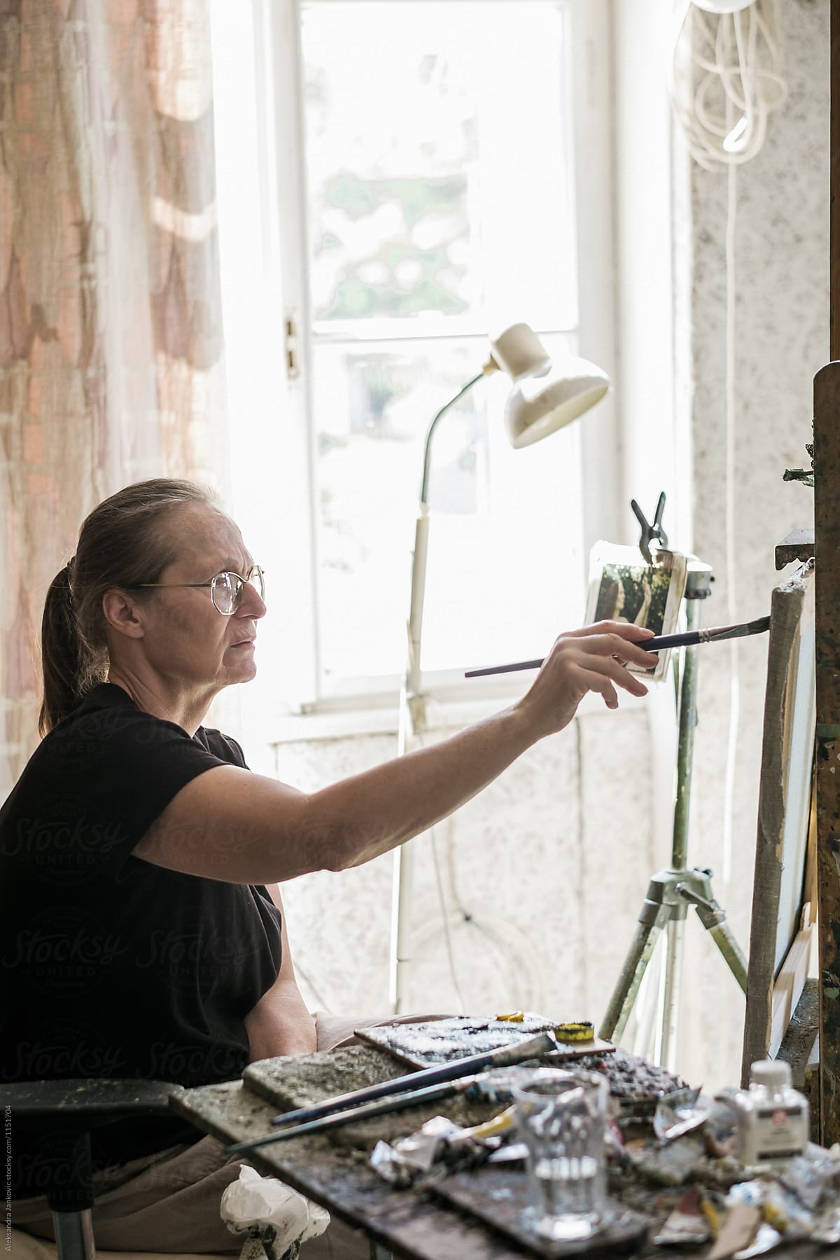Senior Woman Painting In The Studio