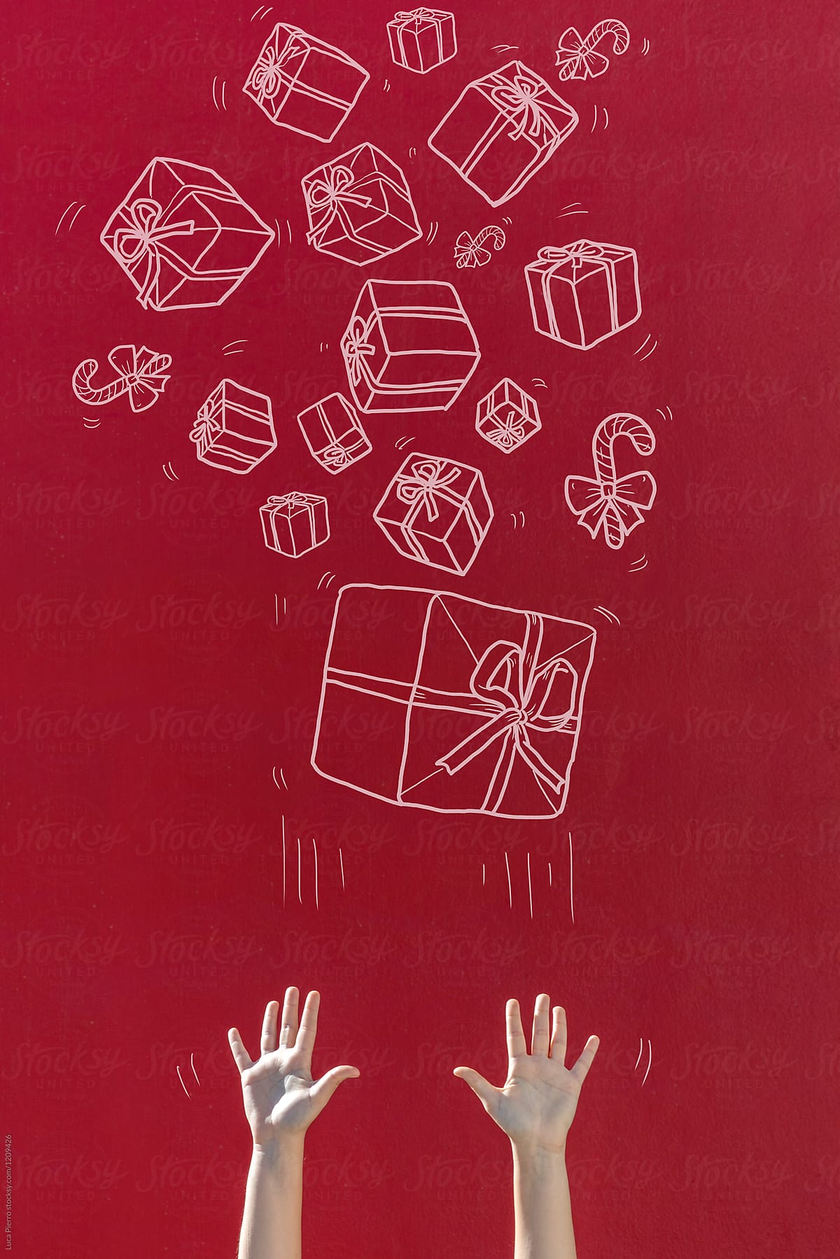 Hands with Christmas presents (mixed media image)