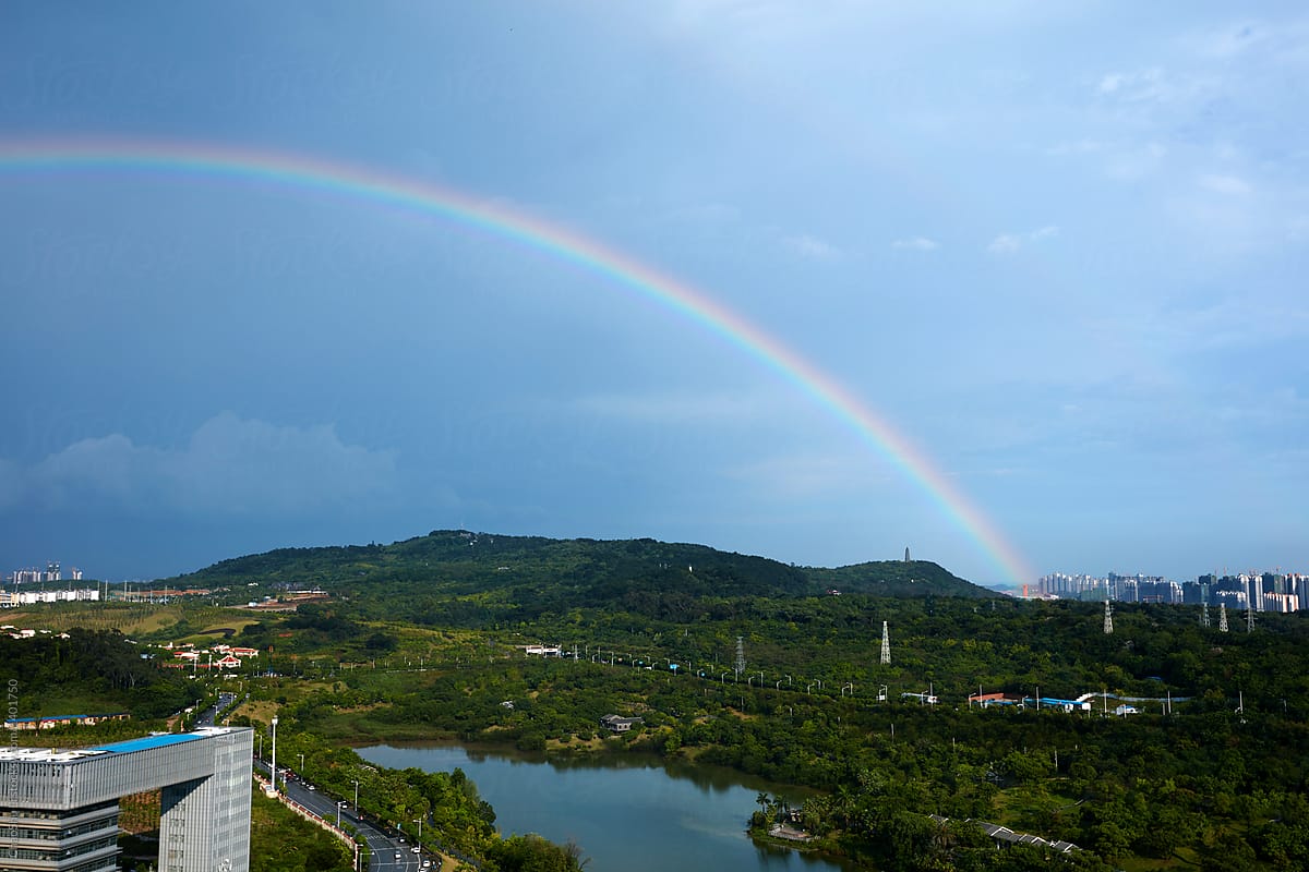 Rainbow after rain, in the context of green city