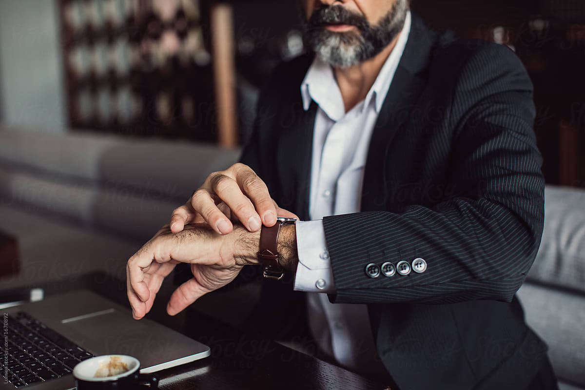 Businessman Looking at Watch