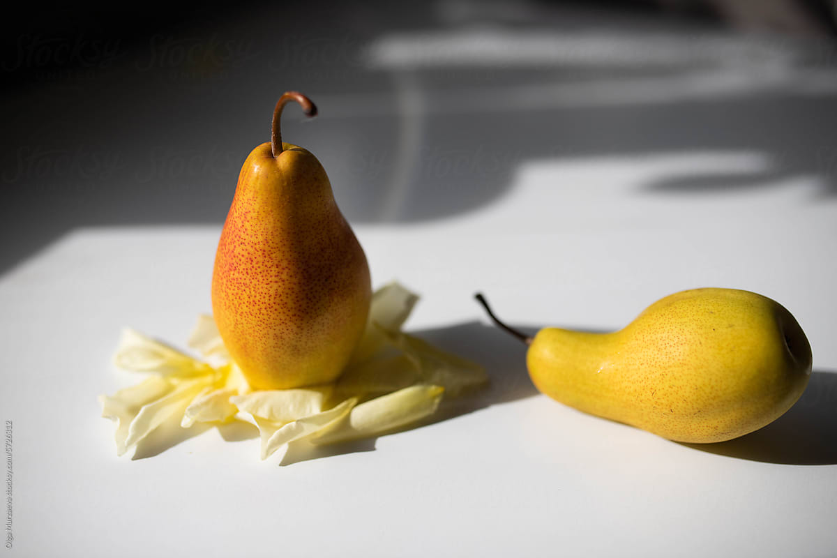 two yellow  pears on the table